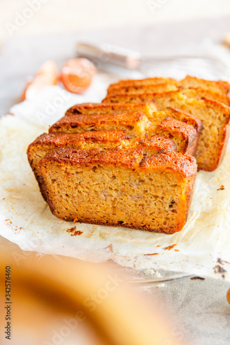 Obraz na płótnie Banana Bread with Ingredients on Grey Background w salonie