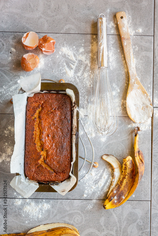 Banana Bread with Ingredients on Grey Background