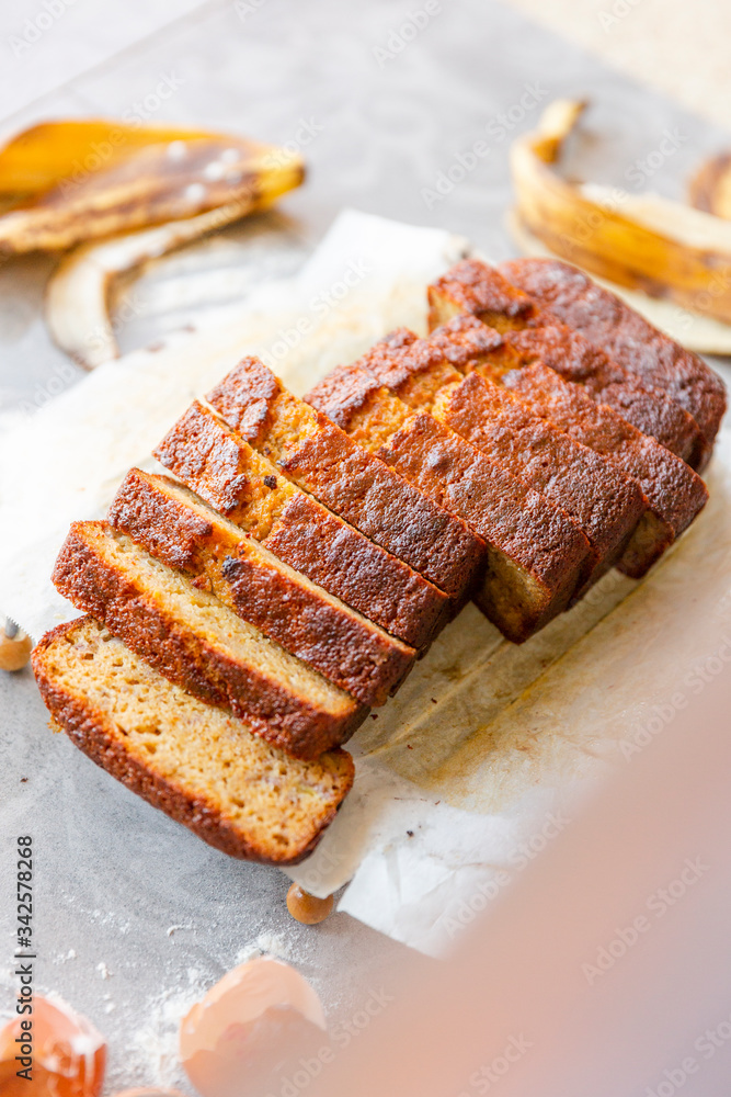 Banana Bread with Ingredients on Grey Background