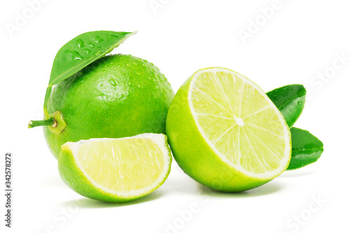 Fresh lime cut half and sliced with green leaf and water drop isolated on white background with clipping path
