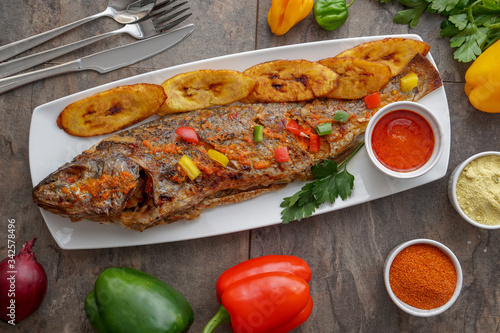 Canvas Print Grilled fish curry with plantain and salad