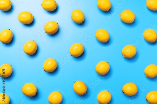 Top view of lemon pattern on a blue background, flat lay for a graphic designer or décor concept