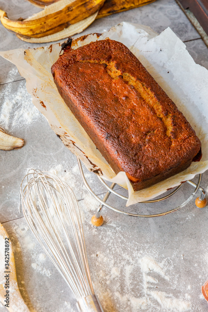 Banana Bread with Ingredients on Grey Background