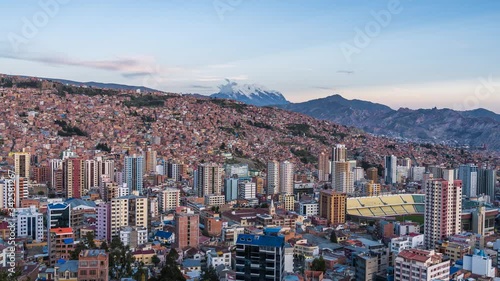 La Paz, Bolivia, day to night timelapse view of cityscape and Illimani mountain.