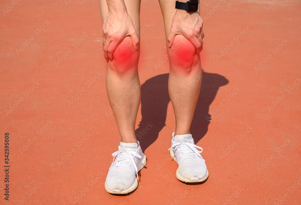 Cropped shot of woman runner suffering from knee pain. It often happens