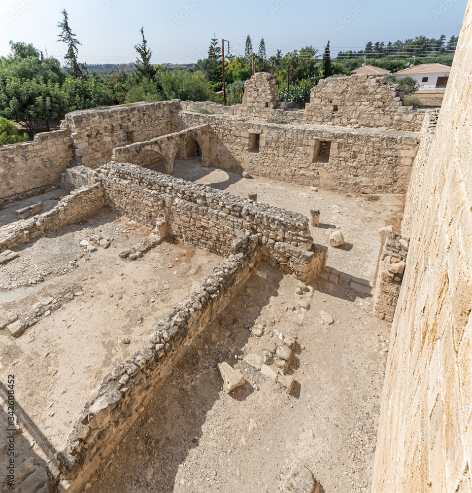 The ruins of the courtyard of the medieval castle of Kolossi, shot at a wide angle. Cyprus