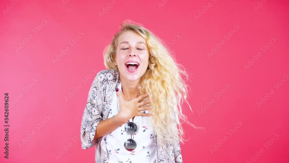 Blonde woman looks surprised and smile happy Blonde woman looks surprised and smile happy