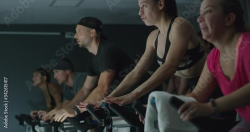 Group of people taking cycling class