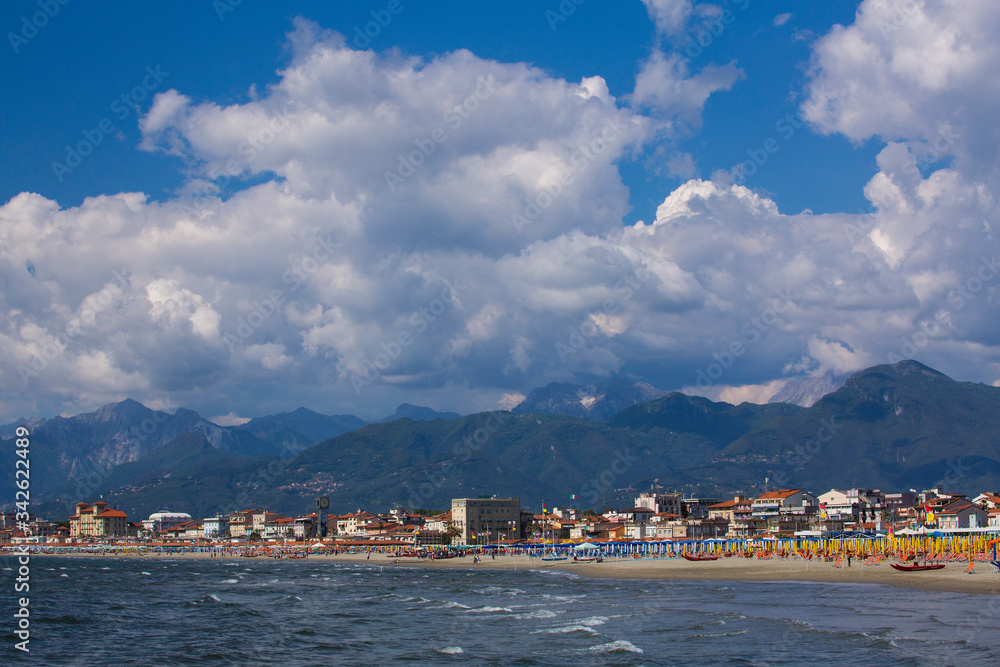 View of Viareggio beachfront with the Apuan Alps behind it. Viareggio is in the Tuscany region of Italy.
