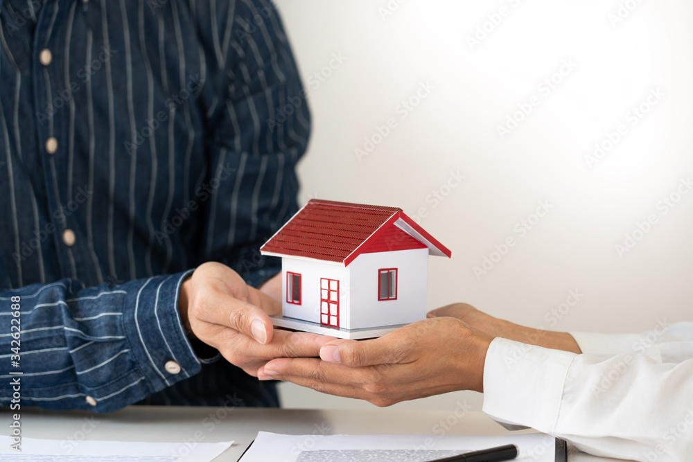House developers and customer shaking hand after accept agreement finish buying or rental real estate for transfer right of property. House developers and customer shaking hand after accept agreement finish buying or rental real estate for transfer right of property.