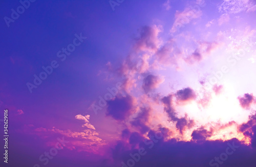 The explosion of light in purple sky with blurry clouds