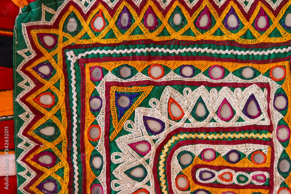 ,Gujarat mirror work close up view,Made of needle cord,Detail patchwork carpet.close up, selective focus, macro embroidery handicrafts,Indian and Ukraine mix embroidery handicrafts close up view ,Gujarat mirror work close up view,Made of needle cord,Detail patchwork carpet.close up, selective focus, macro embroidery handicrafts,Indian and Ukraine mix embroidery handicrafts close up view
