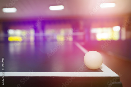 Table tennis ball on table on blurred background for player indoor