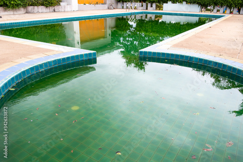 The pool is not clean due to lack of cleaning and maintenance.