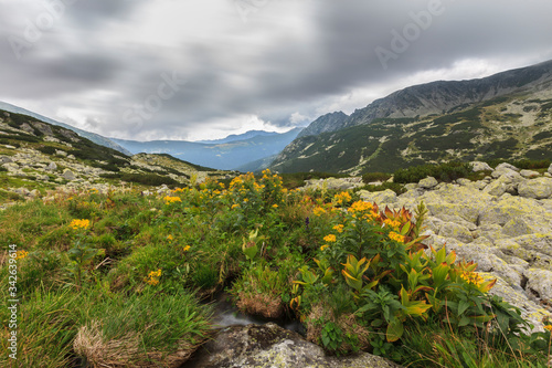 Stormy landscape with granite rocks and glacier lakes in the Transylvanian Alps