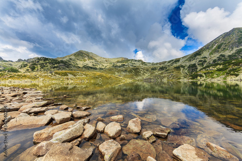 Fototapeta Naklejka Na Ścianę i Meble -  Summer scenery and glacier landscape in the Alps, with beautiful cumulus clouds
