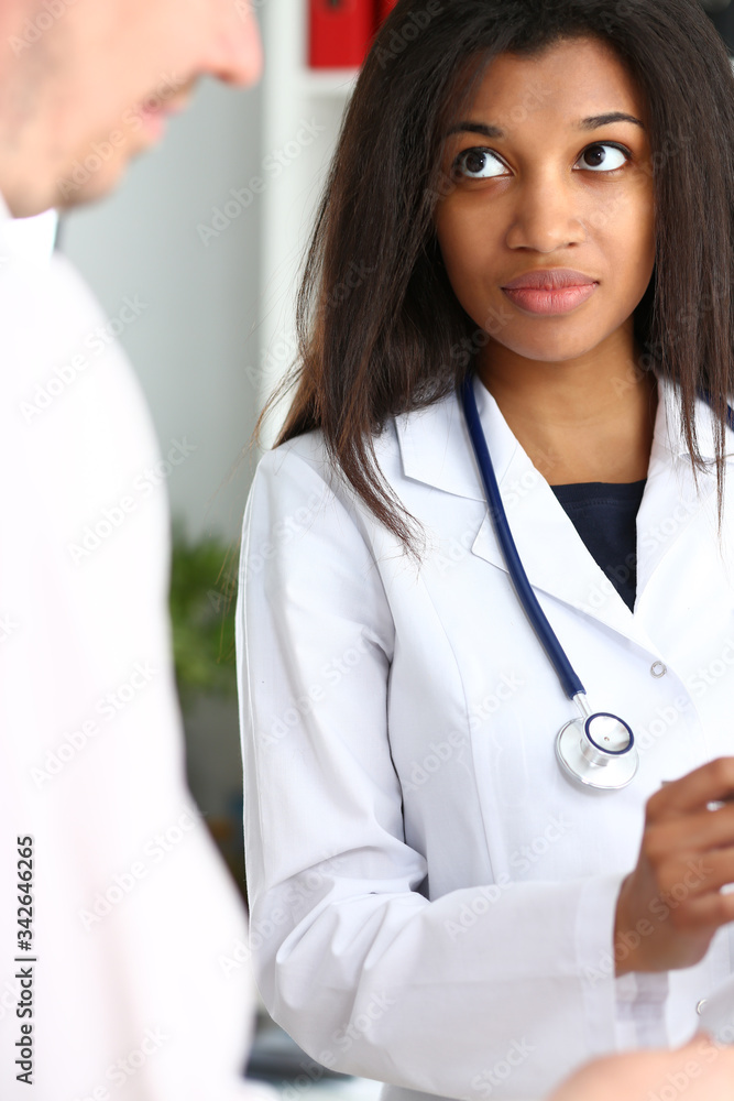 Female doctor hand hold silver pen and showing pad. Physical agreement form signature disease prevention ward round reception consent contract sign prescribe remedy healthy lifestyle concept Female doctor hand hold silver pen and showing pad. Physical agreement form signature disease prevention ward round reception consent contract sign prescribe remedy healthy lifestyle concept