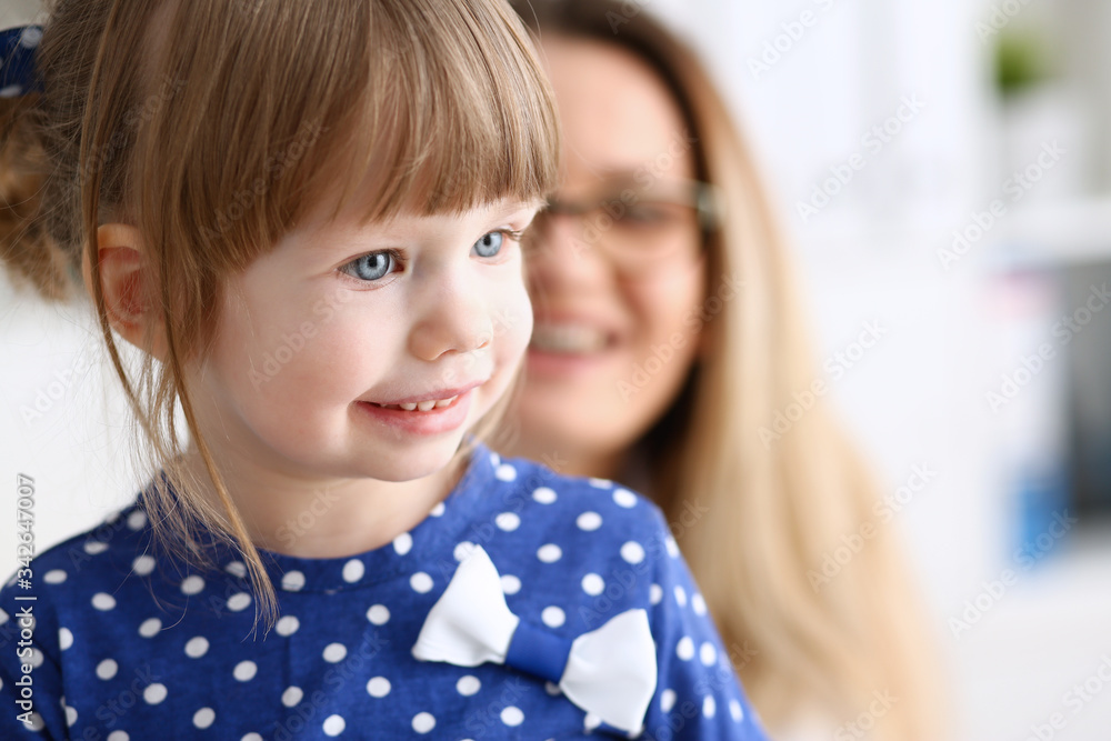 Little child with mother at pediatrician reception. Physical exam cute infant portrait baby aid healthy lifestyle ward round child sickness clinic test high quality and trust concept Little child with mother at pediatrician reception. Physical exam cute infant portrait baby aid healthy lifestyle ward round child sickness clinic test high quality and trust concept