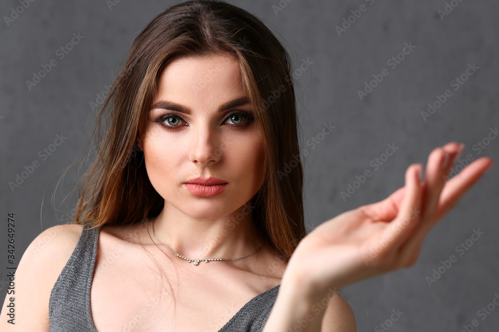Beautiful european woman portrait. Hands up and smiling beauty fashion style caucasian curly hair with white locks eyes look into the camera Beautiful european woman portrait. Hands up and smiling beauty fashion style caucasian curly hair with white locks eyes look into the camera