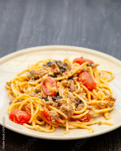 Spaghetti bolognese with tomato  cheese and basil on a plate