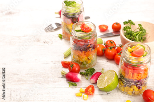rainbow vegetable salad in jar and ingredient