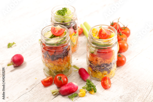 rainbow vegetable salad in jar and ingredient
