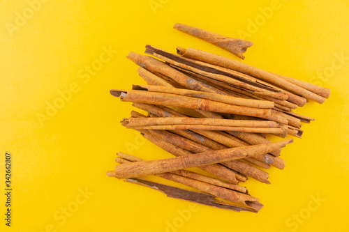 cinnamon on yellow background.