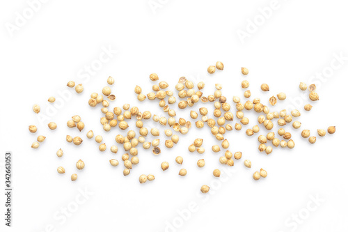 coriander seeds top view on white background.