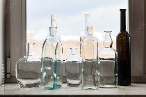 Wallpaper Mural many empty bottles on windowsill and view of park Torontodigital.ca