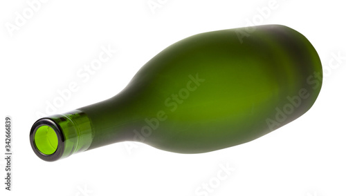 lying empty green brandy bottle isolated on white