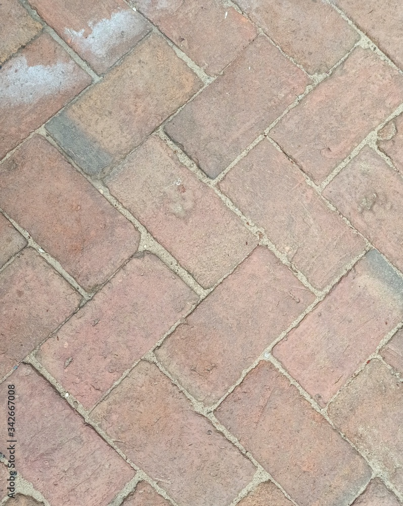The ground covered with many red bricks that can be used as a background The ground covered with many red bricks that can be used as a background