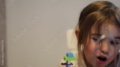 Covid-19 Coronavirus and Learning from home. Little girl online learning and creating at home. Quarantine and Social distancing concept.