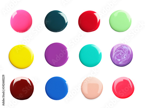 Set of different nail polishes on white background