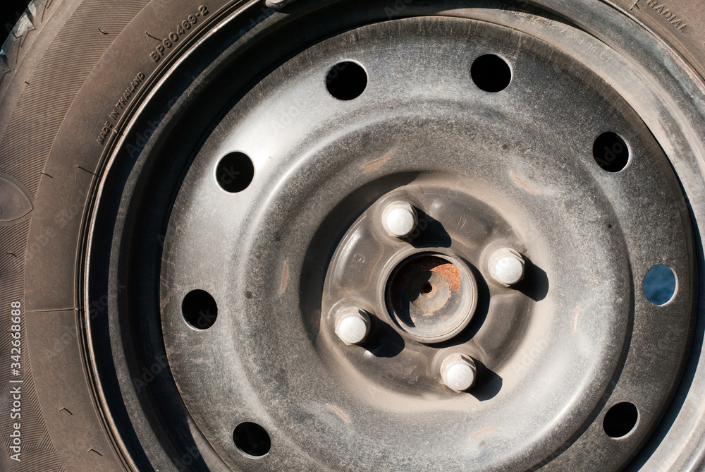 An old car tire wheel without metal cover An old car tire wheel without metal cover