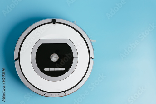 Automatic vacuum cleaner. Wireless Vacuum Cleaner. Smart cleaning technology isolated. Round. Top view. photo