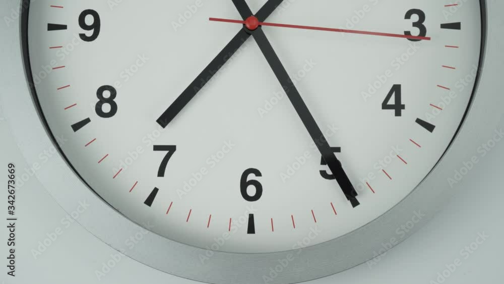 Closeup Gray Wall clock shows time 7 o'clock, Time lapse moving fast, Time concept. Closeup Gray Wall clock shows time 7 o'clock, Time lapse moving fast, Time concept.