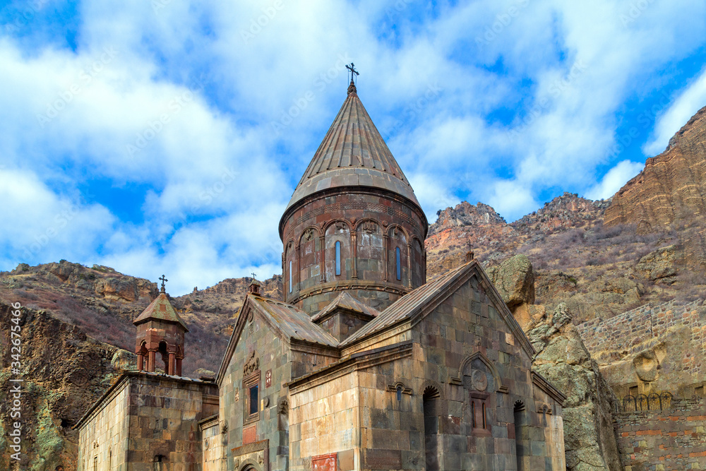 The monastery Geghard, located in the mountains of Armenia The monastery Geghard, located in the mountains of Armenia