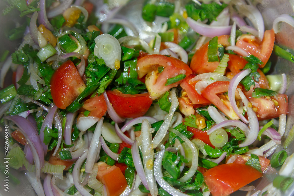 Salad with fresh tomatoes, onions, coriander leaves Salad with fresh tomatoes, onions, coriander leaves