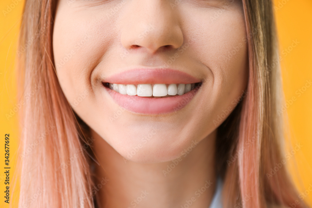 Young woman with healthy teeth on color background, closeup Young woman with healthy teeth on color background, closeup
