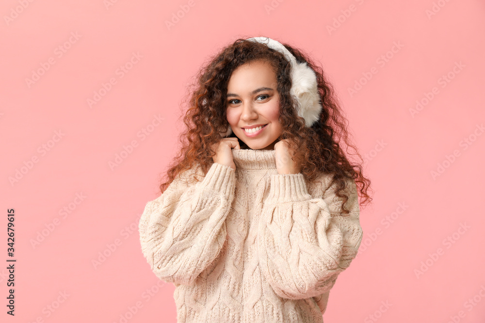 Young woman in warm sweater on color background Young woman in warm sweater on color background