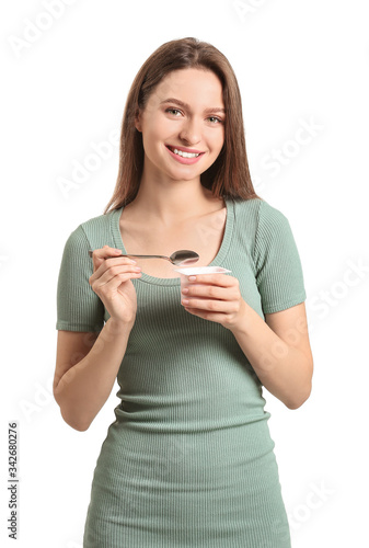 Young woman with tasty yogu...