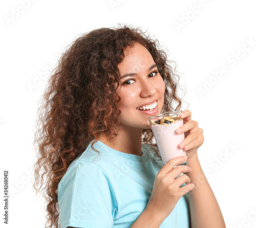 Young woman with tasty yogu...