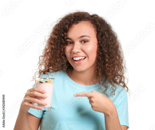 Young woman with tasty yogu...