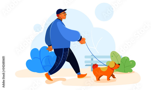 Old man walking with a pet dog in the park.