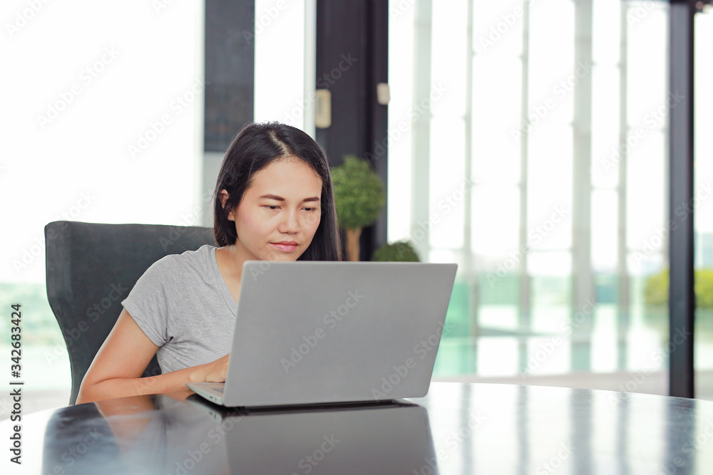 Portrait asian woman using laptop computer working on the table at home. Portrait asian woman using laptop computer working on the table at home.