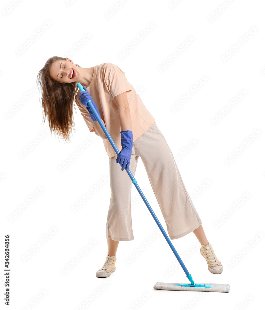 Young woman with mop singing on white background Young woman with mop singing on white background