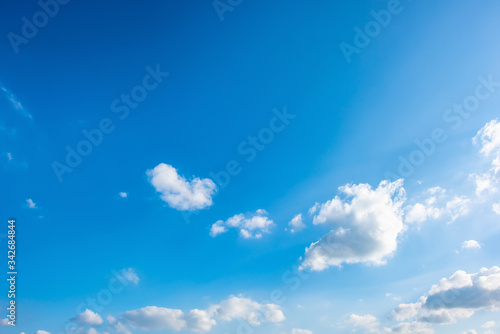 Beautiful blue summer sky with fluffy clouds as a background