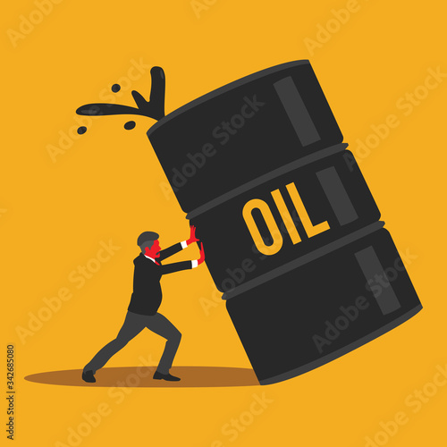 Young businessman tries to keep the oil tank from falling