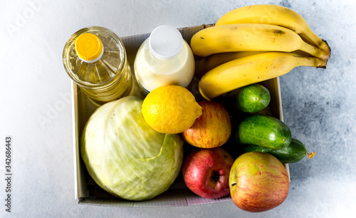 Food Delivery Box Donation Food Donation Concept. donation box with vegetables, fruits and other food for people