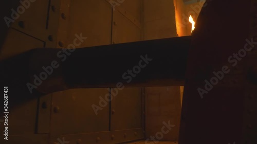 Medieval times, ancient siege, closeup of hitting city's gate with battering ram